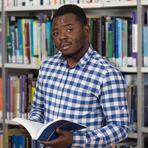 Student reading in the library 