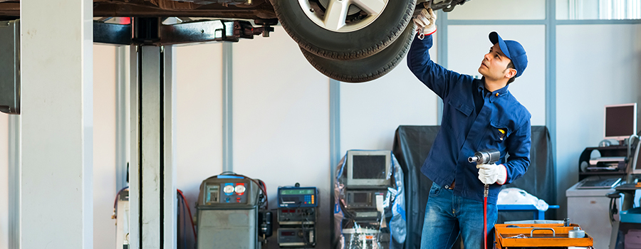 Student working on a car